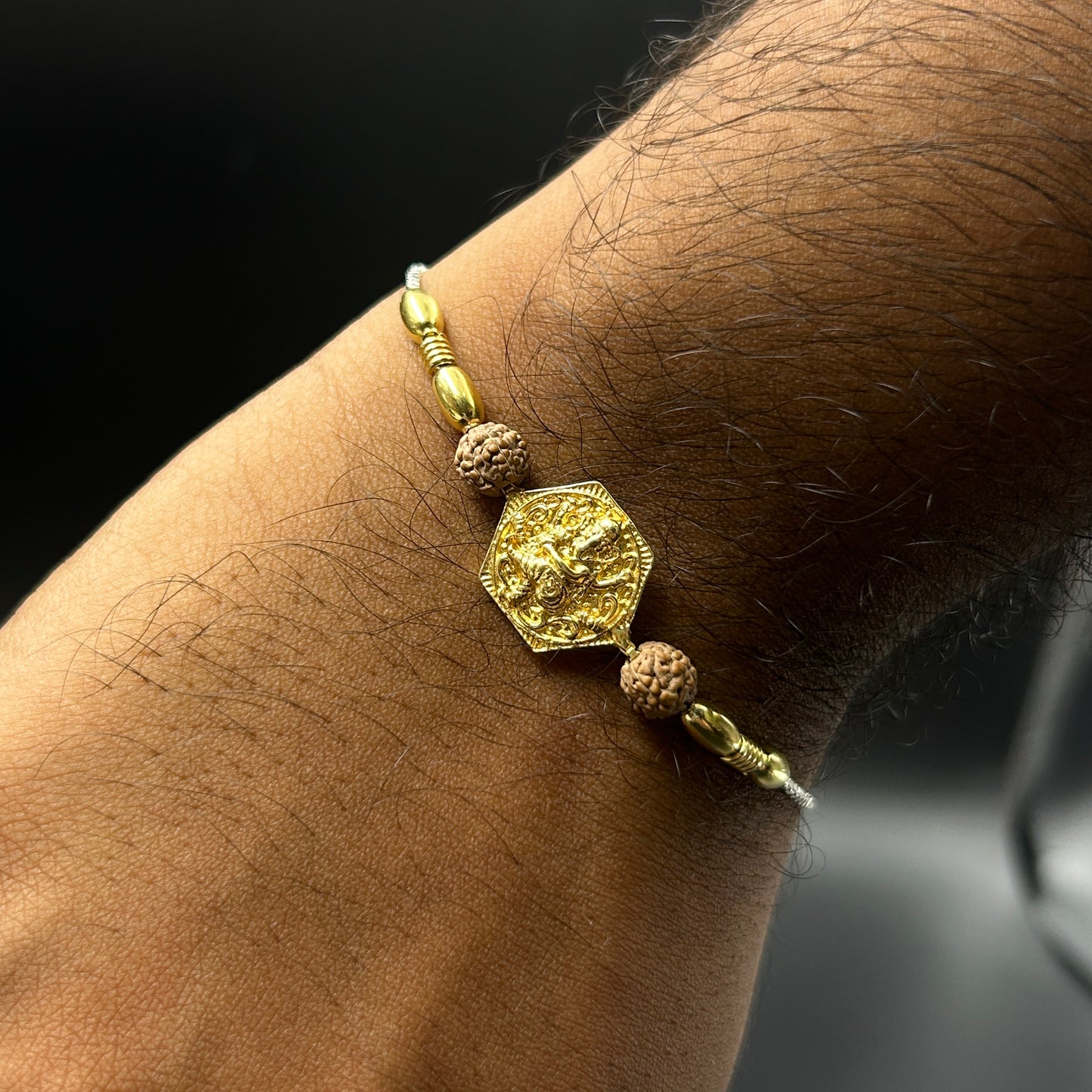 Yellow Gold Ganpati Rakhi with Rudraksh