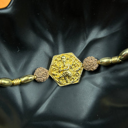 Yellow Gold Ganpati Rakhi with Rudraksh