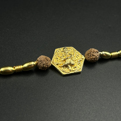 Yellow Gold Ganpati Rakhi with Rudraksh